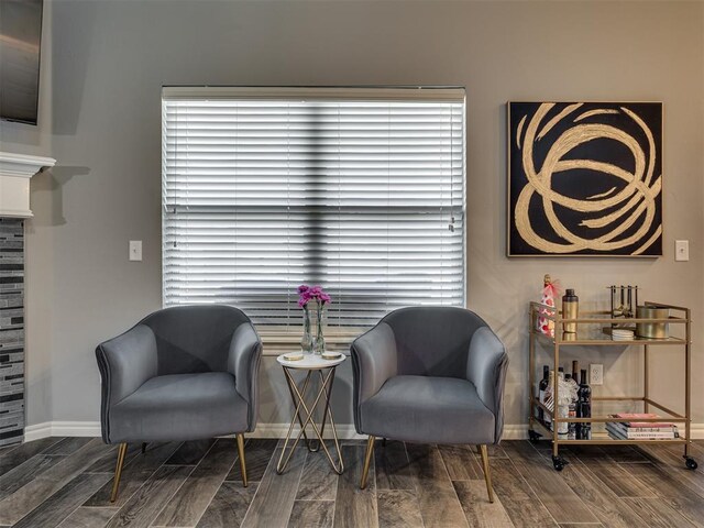 8109 NW 160th Ter, Edmond, OK 73013 - sitting room with wood finished floors and baseboards