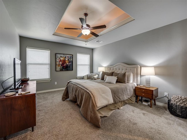 8109 NW 160th Ter, Edmond, OK 73013 - bedroom featuring carpet, baseboards, and a tray ceiling