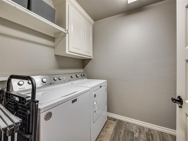 8109 NW 160th Ter, Edmond, OK 73013 - laundry area featuring separate washer and dryer, cabinet space, baseboards, and dark wood-style floors