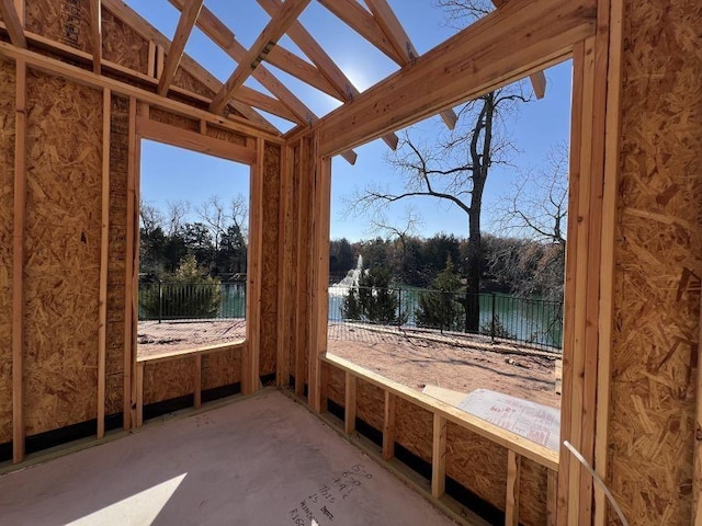 701 Montauk Way, Edmond, OK 73034 - unfurnished sunroom featuring a water view
