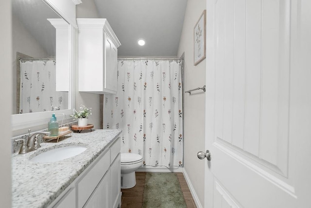 3409 Ontario Cir, Oklahoma City, OK 73160 - bathroom with vanity, toilet, wood finished floors, a shower with curtain, and baseboards