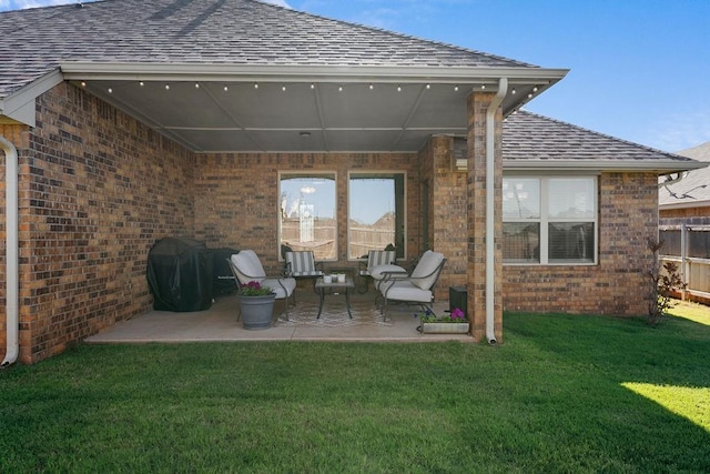 3409 Ontario Cir, Oklahoma City, OK 73160 - back of house with brick siding, a patio area, and roof with shingles