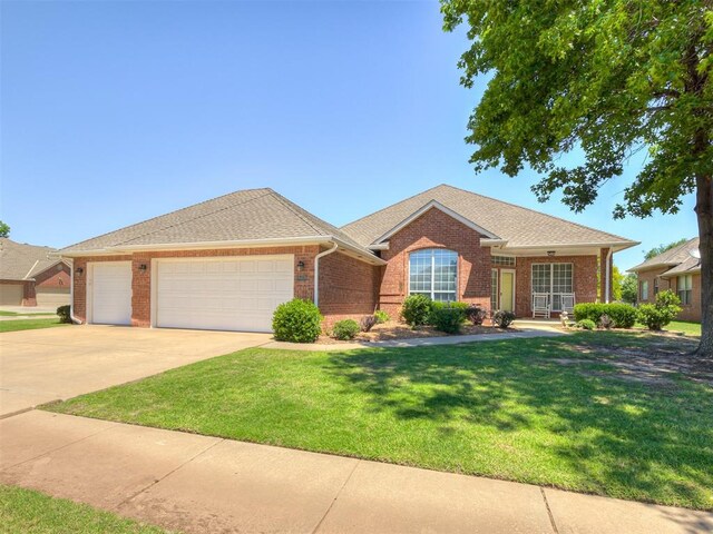 8413 NW 64th Ter, Oklahoma City, OK 73132 - single story home featuring a garage, a front lawn, concrete driveway, brick siding, and a porch