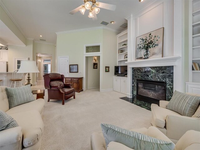 8413 NW 64th Ter, Oklahoma City, OK 73132 - living area with ceiling fan, ornamental molding, baseboards, a high end fireplace, and recessed lighting