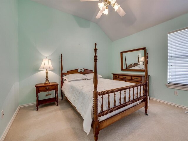 8413 NW 64th Ter, Oklahoma City, OK 73132 - bedroom featuring light carpet, lofted ceiling, baseboards, and a ceiling fan