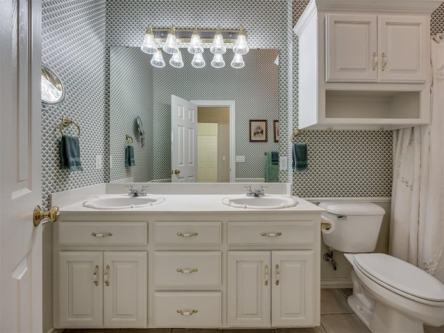 8413 NW 64th Ter, Oklahoma City, OK 73132 - bathroom featuring tile walls, toilet, and double vanity