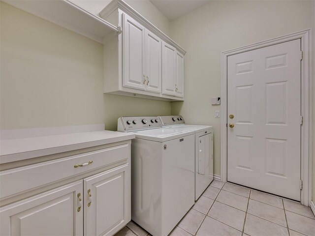 8413 NW 64th Ter, Oklahoma City, OK 73132 - laundry area with washer and dryer, cabinet space, and light tile patterned floors