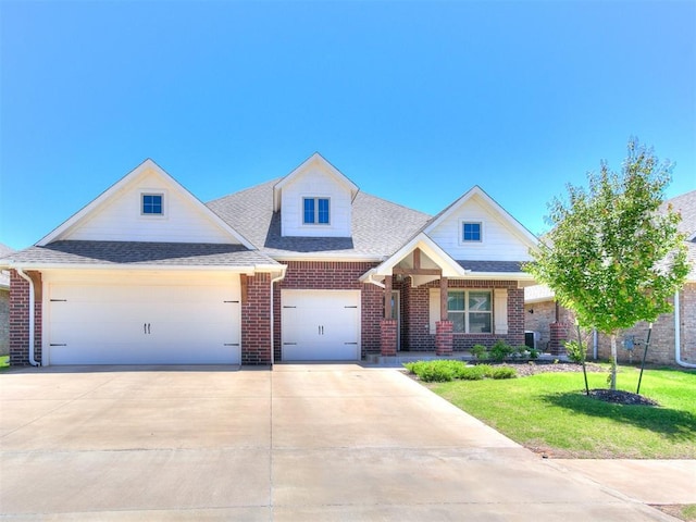 9212 NW 89th St, Yukon, OK 73099 - view of front of house featuring driveway, brick siding, a front yard, an attached garage, and a porch