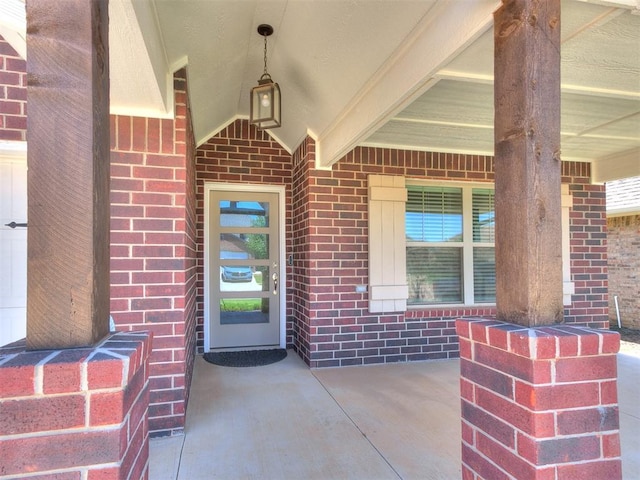 9212 NW 89th St, Yukon, OK 73099 - property entrance featuring brick siding and covered porch