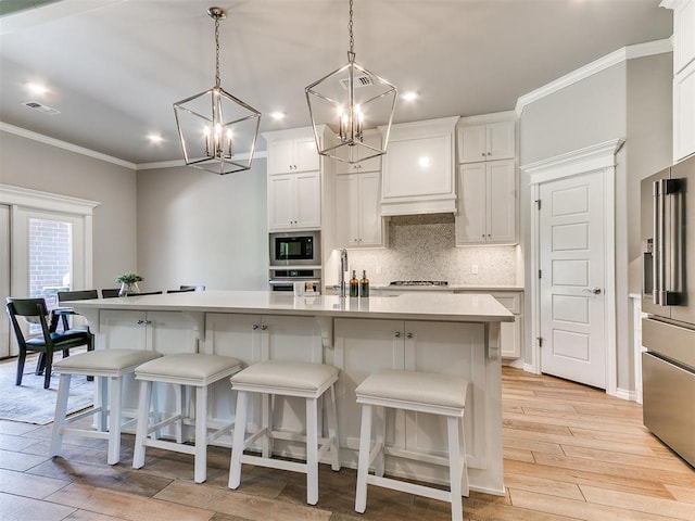 9212 NW 89th St, Yukon, OK 73099 - kitchen featuring a chandelier, stainless steel appliances, backsplash, recessed lighting, and light countertops