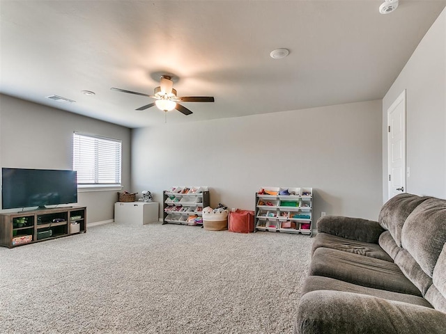 9212 NW 89th St, Yukon, OK 73099 - carpeted living area with a ceiling fan