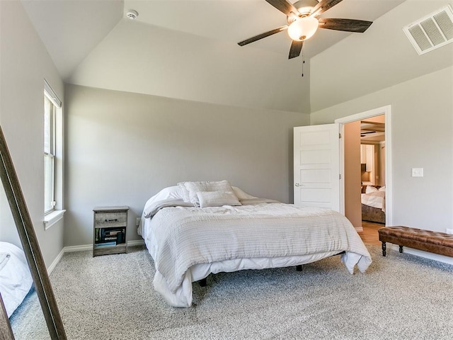 9212 NW 89th St, Yukon, OK 73099 - bedroom with vaulted ceiling, light carpet, baseboards, and ceiling fan
