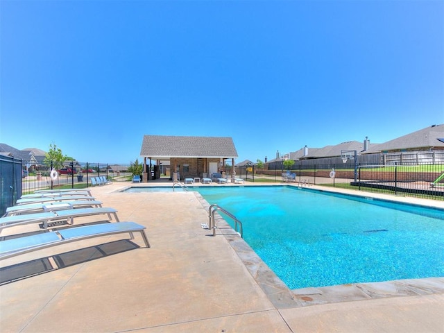 9212 NW 89th St, Yukon, OK 73099 - community pool featuring a patio and a residential view