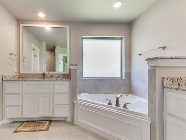 9212 NW 89th St, Yukon, OK 73099 - full bath featuring vanity, a bath, and tile patterned floors