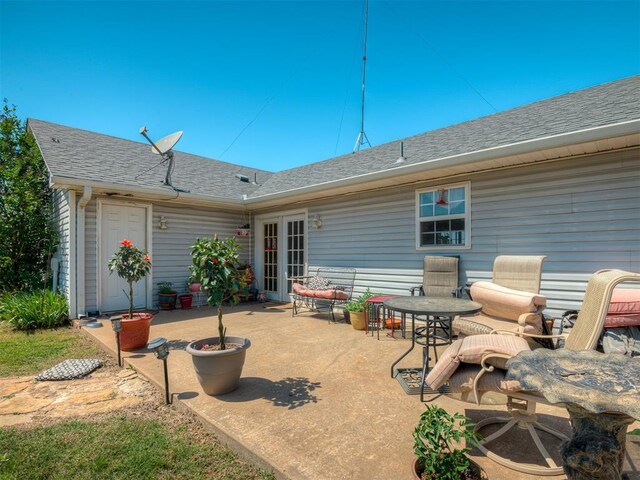 870756 S 3460th Rd, Chandler, OK 74834 - back of house featuring roof with shingles and a patio