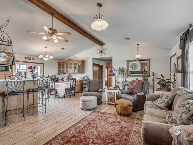 870756 S 3460th Rd, Chandler, OK 74834 - living area with light wood-style floors, a ceiling fan, and a chandelier