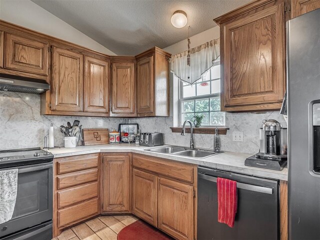 870756 S 3460th Rd, Chandler, OK 74834 - kitchen with range with electric stovetop, dishwasher, stainless steel fridge, a sink, and range hood
