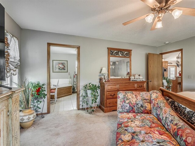 870756 S 3460th Rd, Chandler, OK 74834 - living area with light colored carpet, ceiling fan, and baseboards