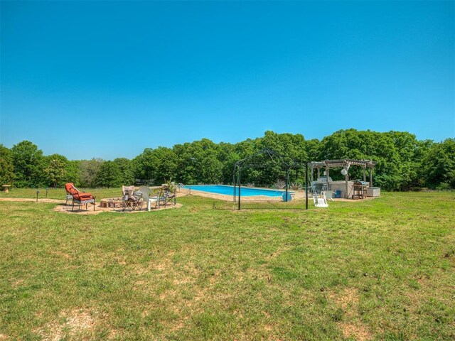 870756 S 3460th Rd, Chandler, OK 74834 - view of green lawn featuring a pergola, a fire pit, an outdoor pool, and a patio