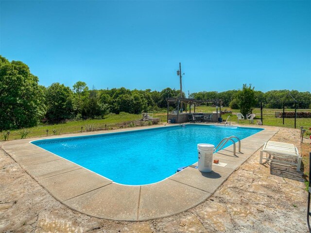 870756 S 3460th Rd, Chandler, OK 74834 - outdoor pool featuring view of wooded area