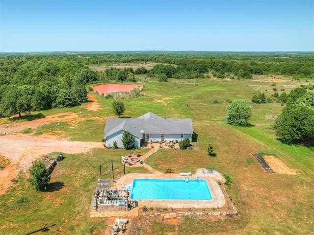 870756 S 3460th Rd, Chandler, OK 74834 - view from above of property with a pool area and a heavily wooded area