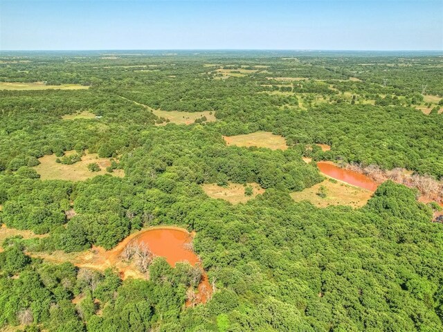 870756 S 3460th Rd, Chandler, OK 74834 - aerial overview of property's location featuring a heavily wooded area