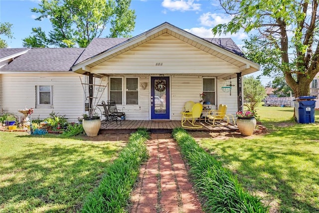 208 W Broadway St, Custer City, OK 73639 - view of front facade featuring a shingled roof, a front yard, and a porch