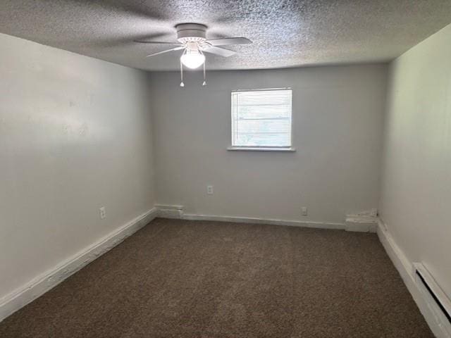3229 NE 14th Pl, Oklahoma City, OK 73117 - empty room featuring a baseboard heating unit, carpet, a ceiling fan, a textured ceiling, and baseboards