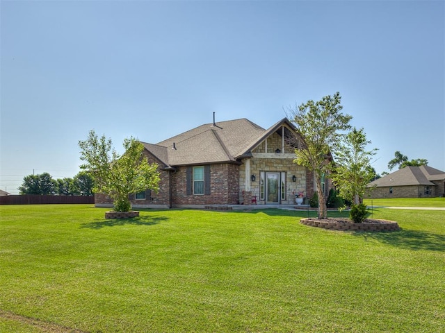 18854 Marbella Ln, Harrah, OK 73045 - view of front of home with a front lawn and stone siding