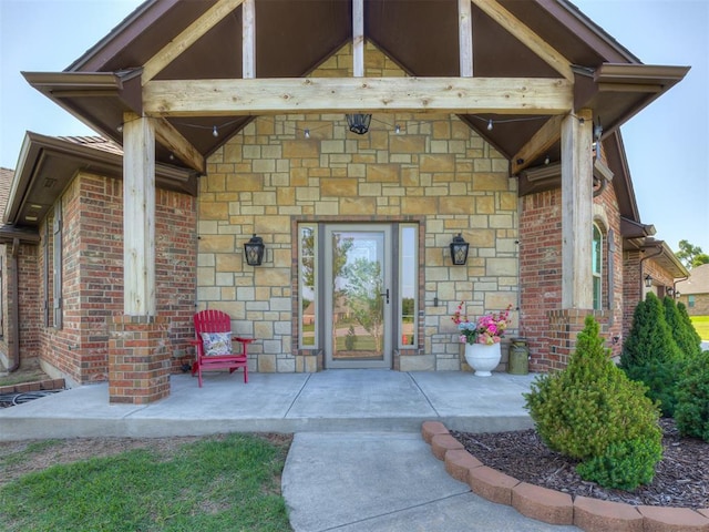 18854 Marbella Ln, Harrah, OK 73045 - view of exterior entry with stone siding and brick siding