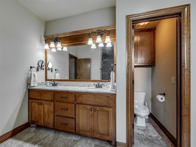 18854 Marbella Ln, Harrah, OK 73045 - bathroom with double vanity, toilet, and baseboards