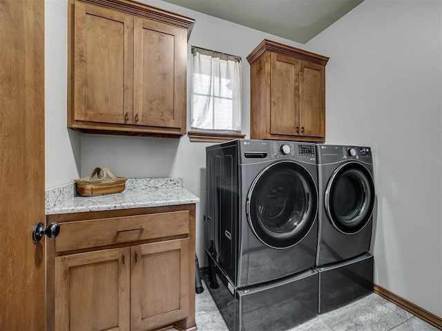 18854 Marbella Ln, Harrah, OK 73045 - laundry room featuring cabinet space, washer and clothes dryer, and baseboards