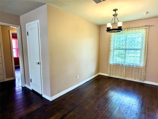 264 E Coe Dr, Midwest City, OK 73110 - spare room with plenty of natural light, hardwood / wood-style flooring, and baseboards