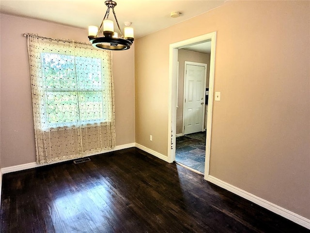 264 E Coe Dr, Midwest City, OK 73110 - empty room featuring a chandelier, wood finished floors, a smoke detector, and baseboards
