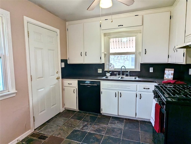 264 E Coe Dr, Midwest City, OK 73110 - kitchen featuring black appliances, a sink, dark countertops, and healthy amount of natural light