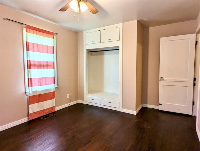264 E Coe Dr, Midwest City, OK 73110 - unfurnished bedroom featuring dark wood-style floors and baseboards