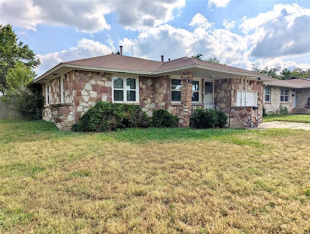 264 E Coe Dr, Midwest City, OK 73110 - view of front of home with stone siding, a front yard, and covered porch