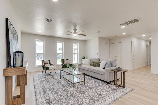 1309 NW 106th St, Oklahoma City, OK 73114 - living room with light wood finished floors, baseboards, ceiling fan, and recessed lighting