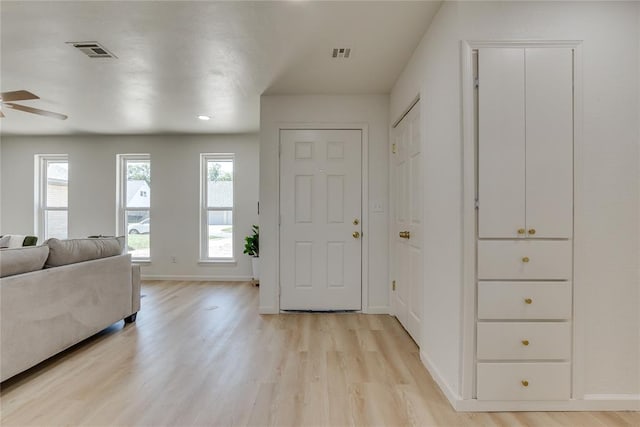 1309 NW 106th St, Oklahoma City, OK 73114 - entrance foyer featuring light wood-style floors, a ceiling fan, and baseboards