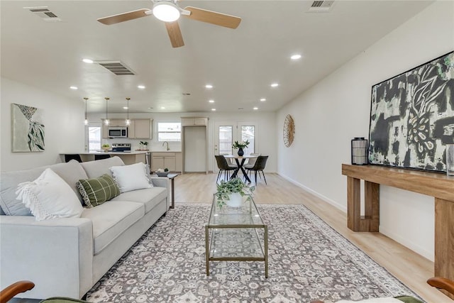 1309 NW 106th St, Oklahoma City, OK 73114 - living area featuring light wood-type flooring, a ceiling fan, recessed lighting, and baseboards