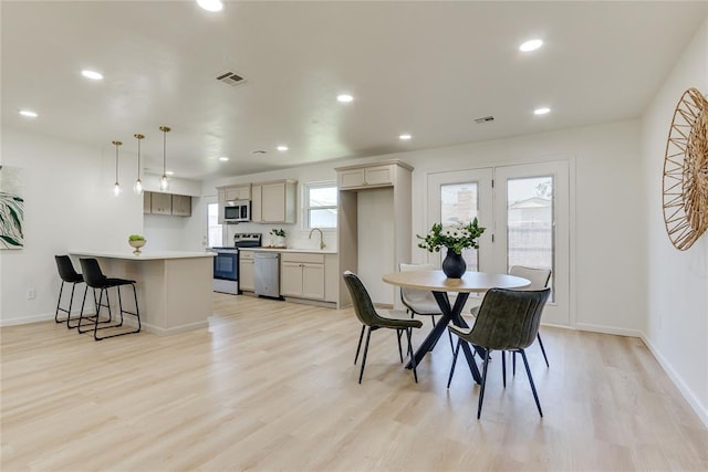 1309 NW 106th St, Oklahoma City, OK 73114 - dining room featuring light wood-type flooring, recessed lighting, and baseboards