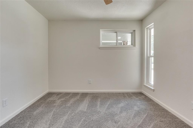 1309 NW 106th St, Oklahoma City, OK 73114 - carpeted empty room with baseboards, a textured ceiling, and ceiling fan
