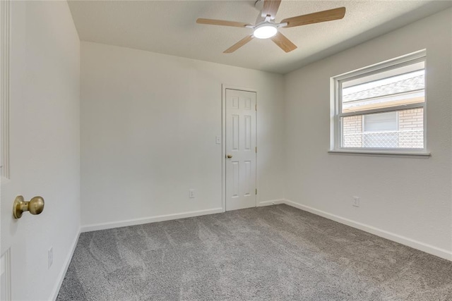 1309 NW 106th St, Oklahoma City, OK 73114 - empty room with a ceiling fan, carpet flooring, and baseboards