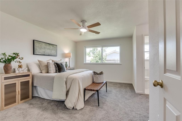 1309 NW 106th St, Oklahoma City, OK 73114 - bedroom featuring light colored carpet, connected bathroom, baseboards, and ceiling fan