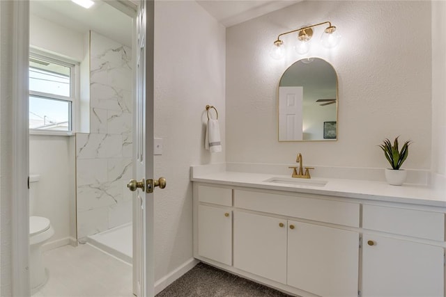 1309 NW 106th St, Oklahoma City, OK 73114 - bathroom featuring vanity, toilet, a marble finish shower, and baseboards