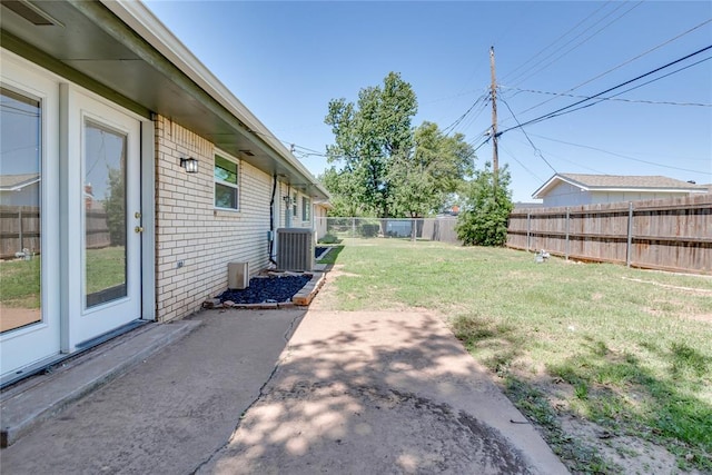 1309 NW 106th St, Oklahoma City, OK 73114 - view of yard featuring central AC unit and a patio area