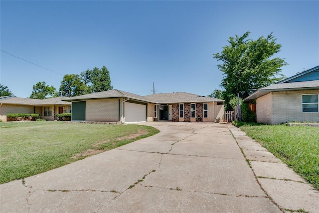 1309 NW 106th St, Oklahoma City, OK 73114 - single story home featuring brick siding, a front lawn, a garage, and driveway