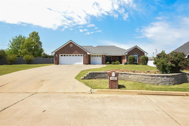 605 S Timber Ridge Dr, Cushing, OK 74023 - view of front of house with a garage, driveway, and brick siding