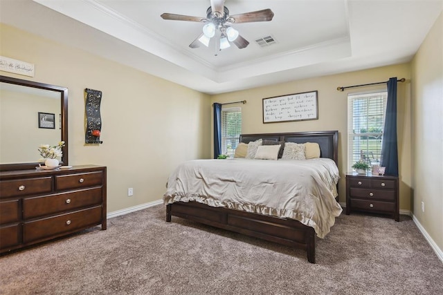 605 S Timber Ridge Dr, Cushing, OK 74023 - bedroom featuring a tray ceiling, carpet floors, ornamental molding, and baseboards