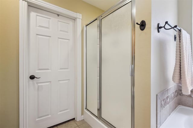 605 S Timber Ridge Dr, Cushing, OK 74023 - bathroom featuring a stall shower, tile patterned flooring, and a bath